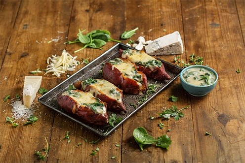 Baked Sweet Potato with Three Cheese Sauce and Spinach