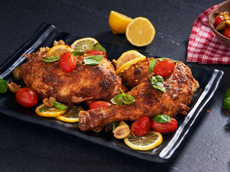Grilled BBQ Chicken Quarters with Tomatoes, Olives and Basil