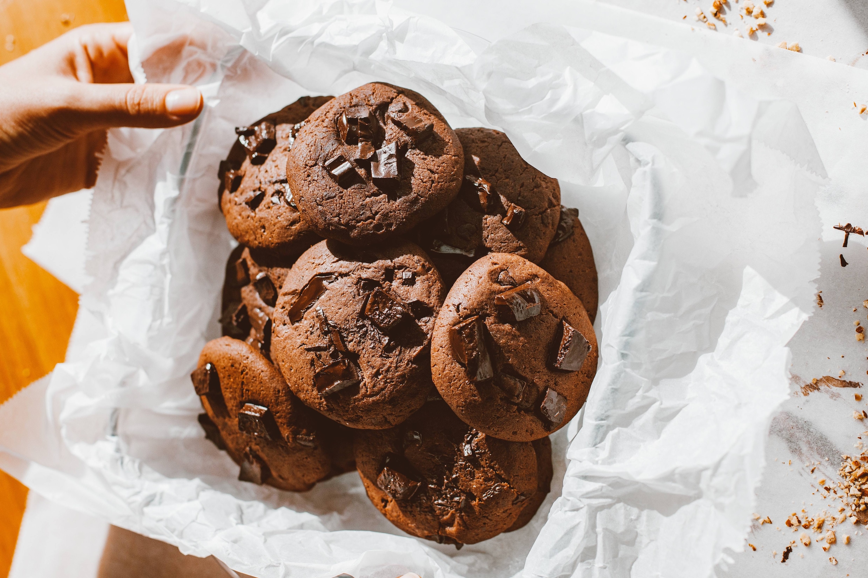 Adobo Chocolate Chip Cookies in a basket with parchment paper