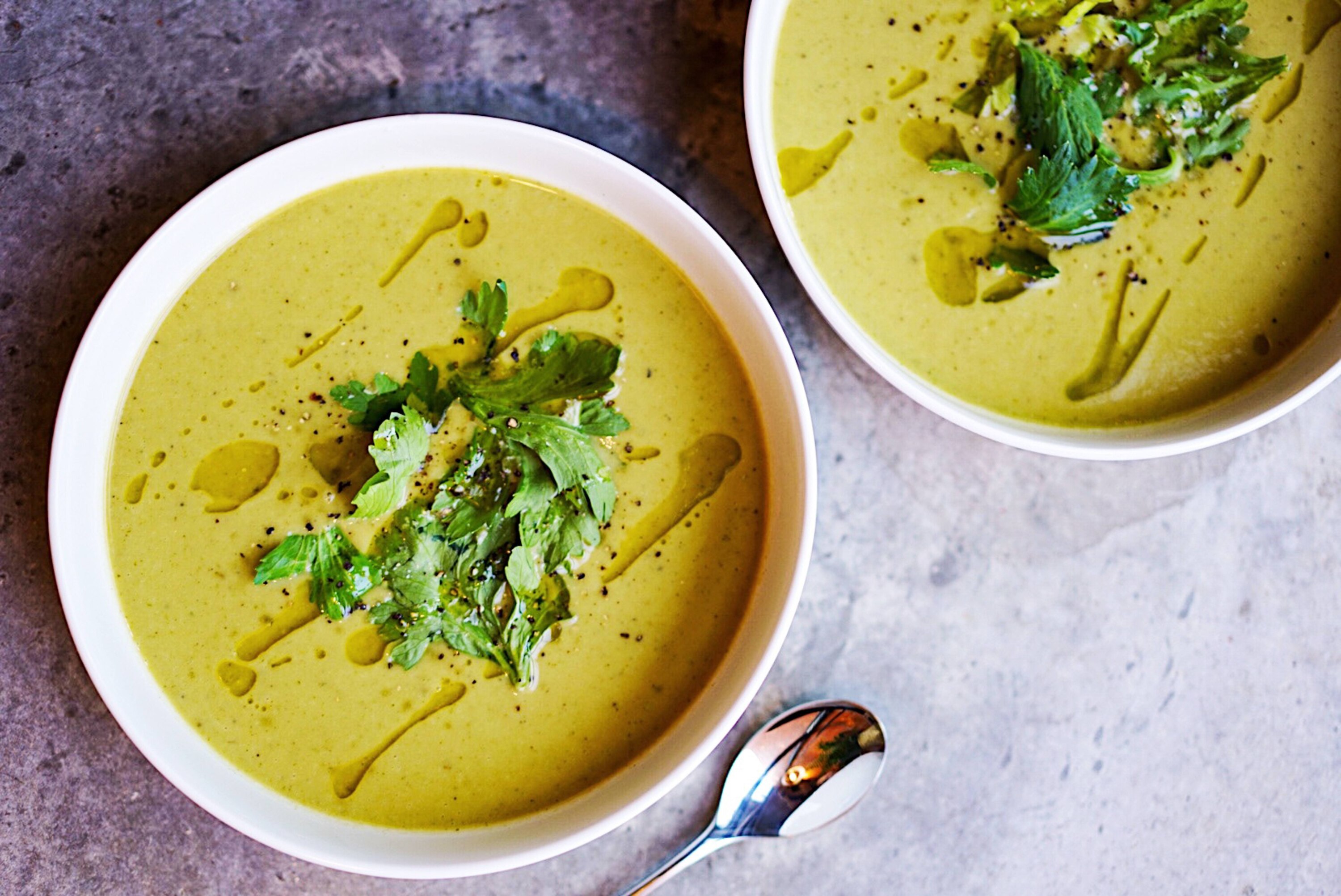 Cream of Asparagus and Mushroom soup topped with parsley and oil