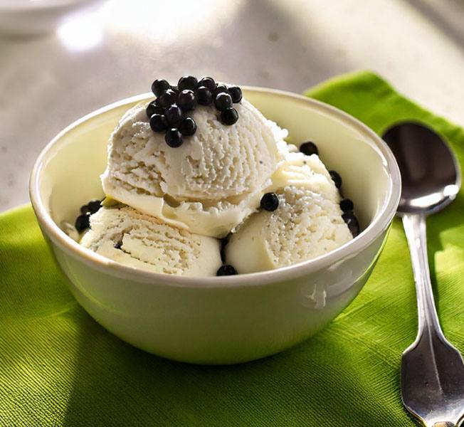 Scoops of Vanilla boba ice cream in a bowl topped with tapioca pearls