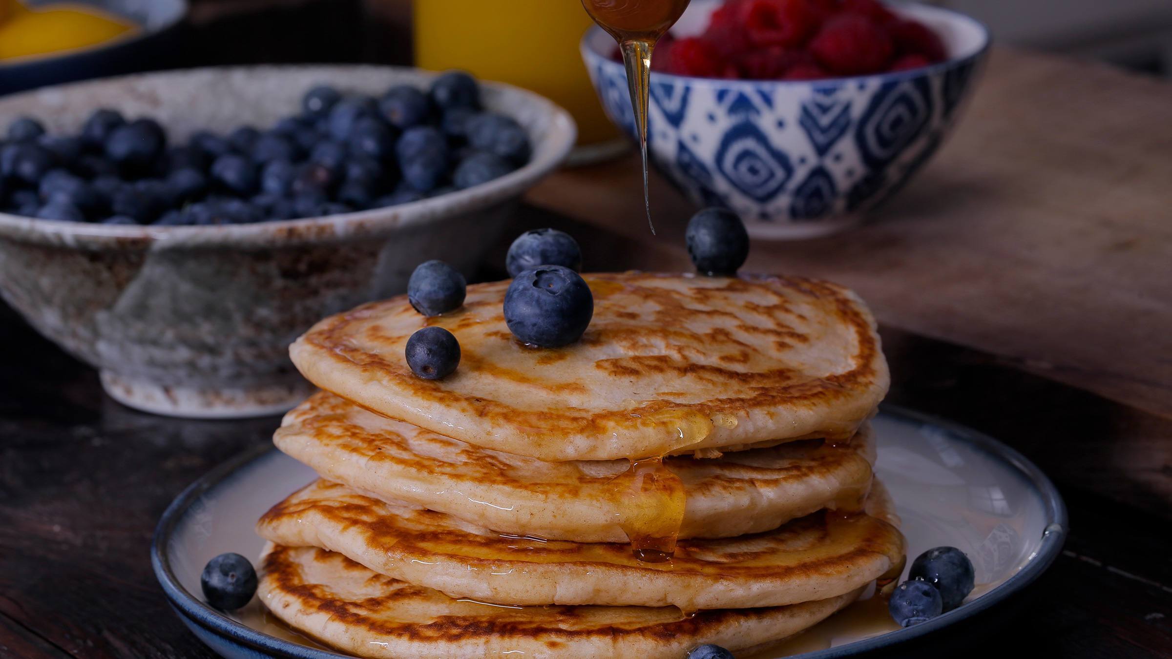American Pancakes on a plate with blueberries on top