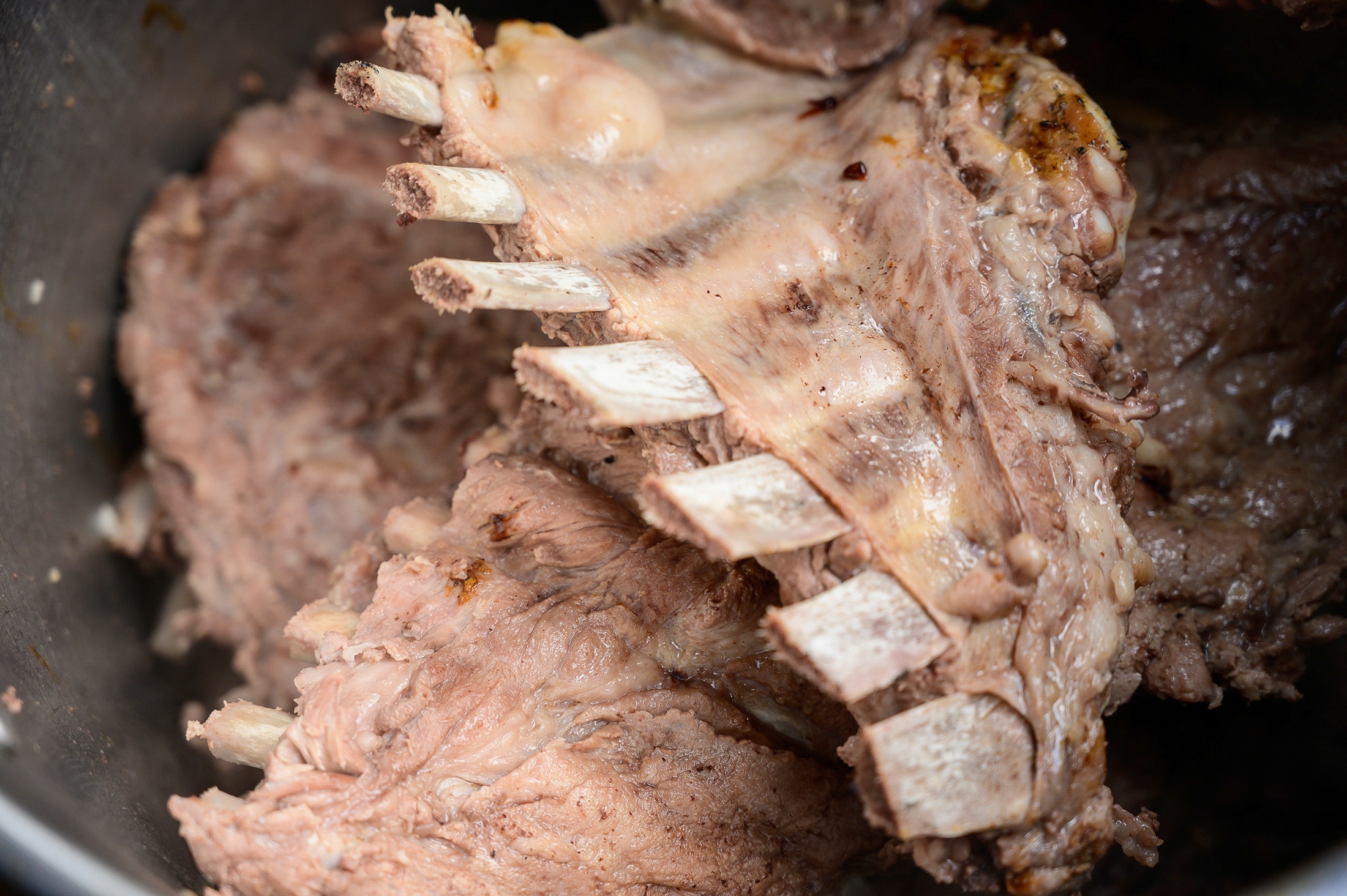 Boiling pork outlet ribs before grilling