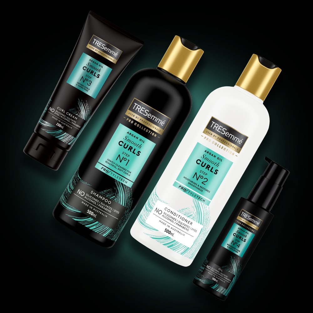 Product shot of TRESemmé Smooth Curls shampoo, conditioner, cream and oil