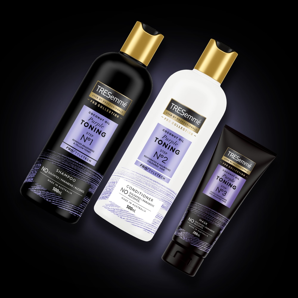 Product shot of TRESemmé Purple Toning shampoo, conditioner and mask