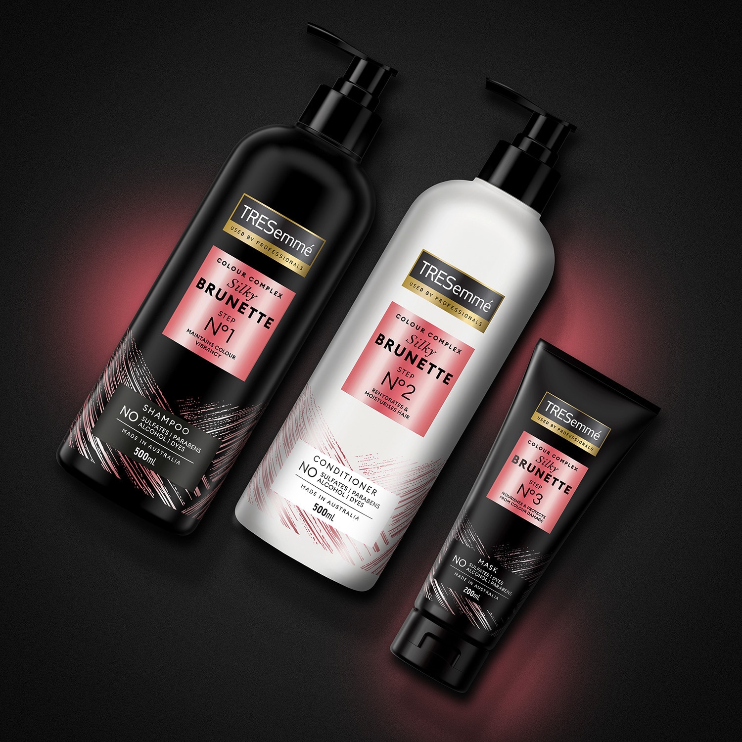 Product shot of TRESemmé Silky Brunette shampoo, conditioner, and mask