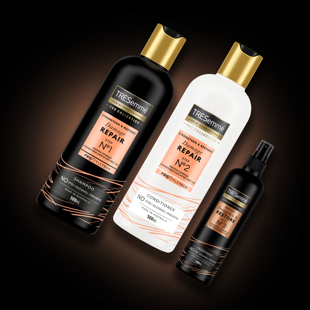 Product shot of TRESemmé Damage Repair shampoo, conditioner, and treatment