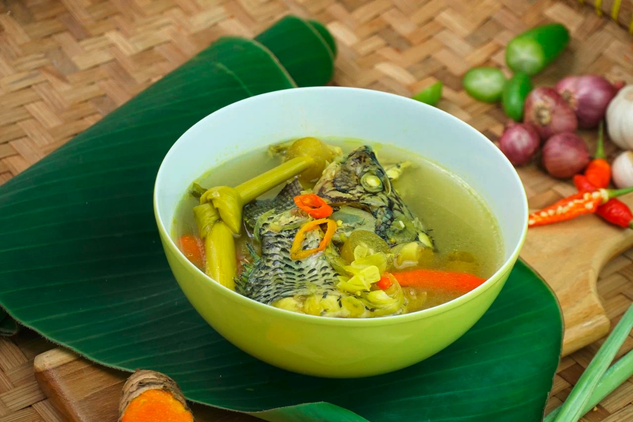 A bowl of pinangat na tilapia with chilies, tanglad, and kamias