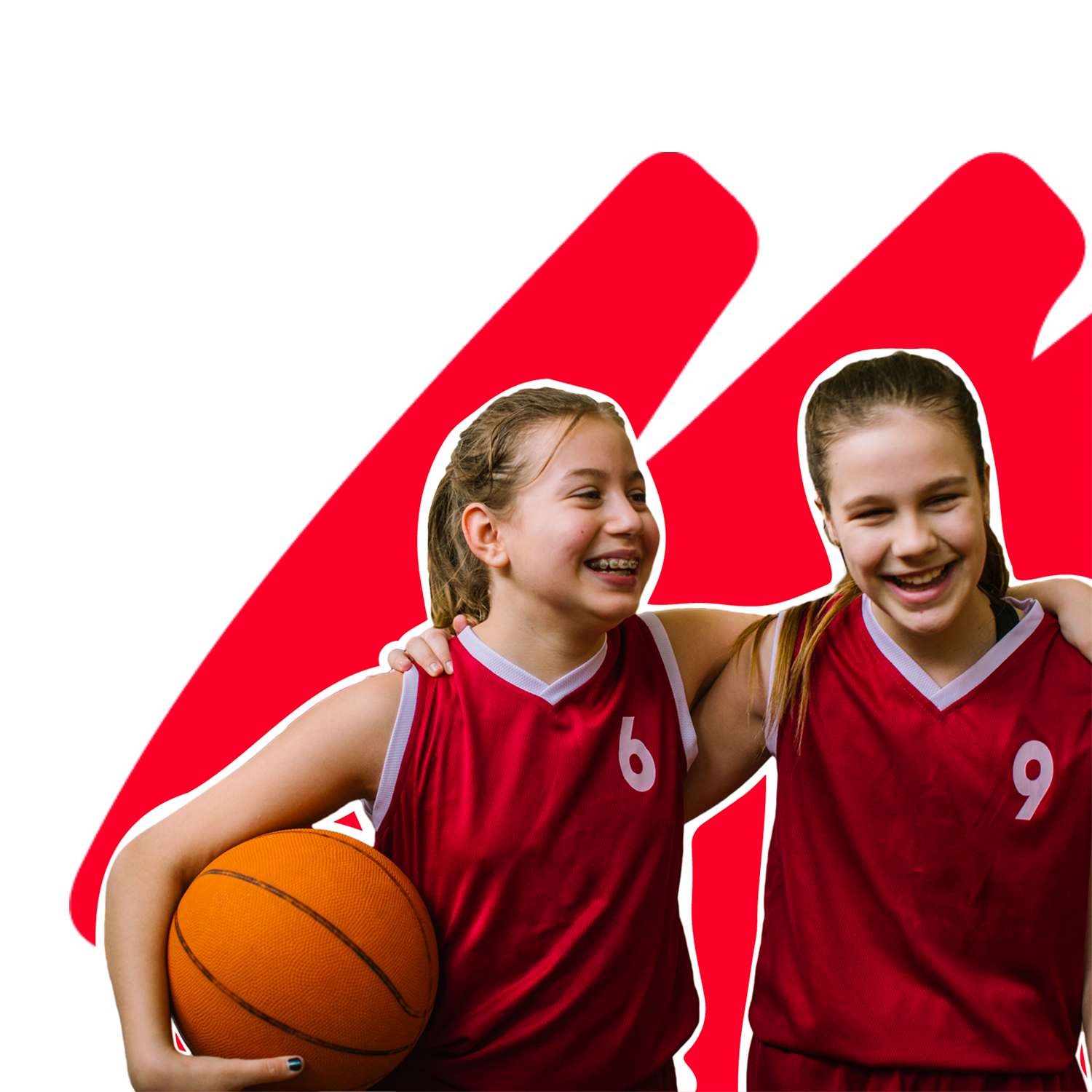 Two young girls wearing sports jerseys, hugging over the shoulder and one of them is holding a basketball under her arm 