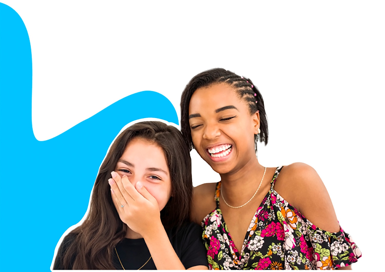 Two young girls laughing together, one of them is covering her mouth with her hand