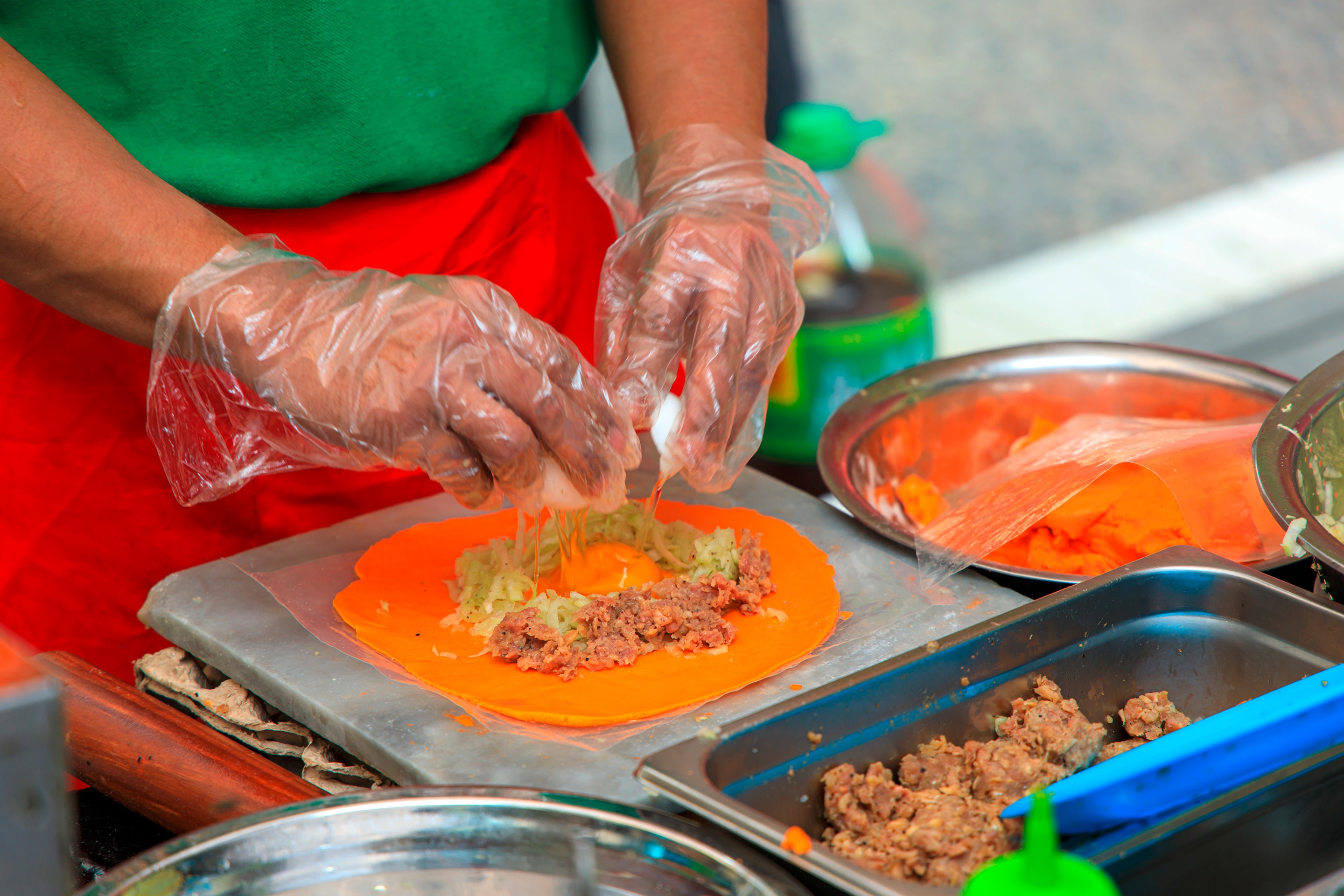 A person prepares Ilocos-style empanadas from scratch