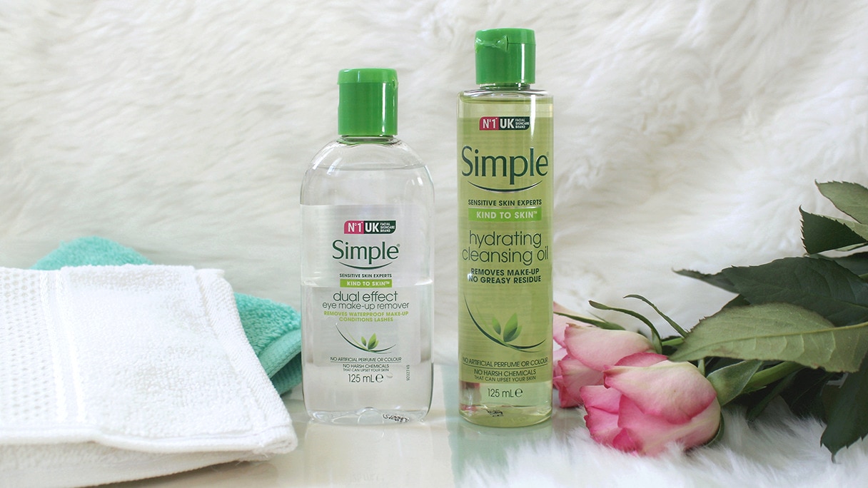 Simple Facial Cleansing Oil and Simple Dual Effect Eye Make-Up Remover with a notebook and rose.