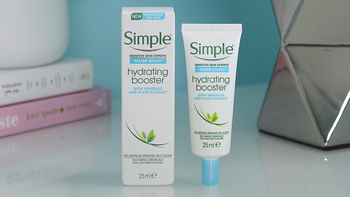 Simple Water Boost Hydrating Booster with its box on bedside table