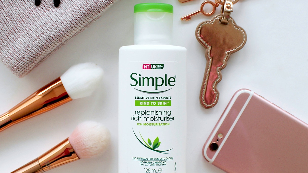 Simple Replenishing Moisturiser with make-up brushes, keys and a mobile phone in the background