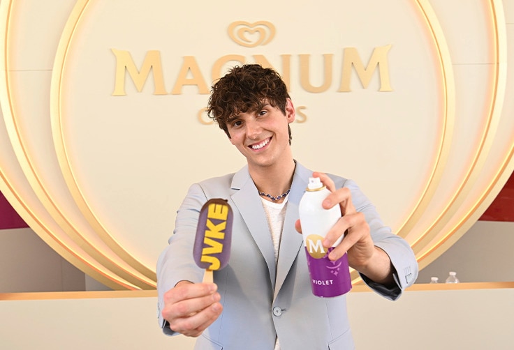 JVKE holding his personalised JVKE initials Magnum and a cocoa velvet spray