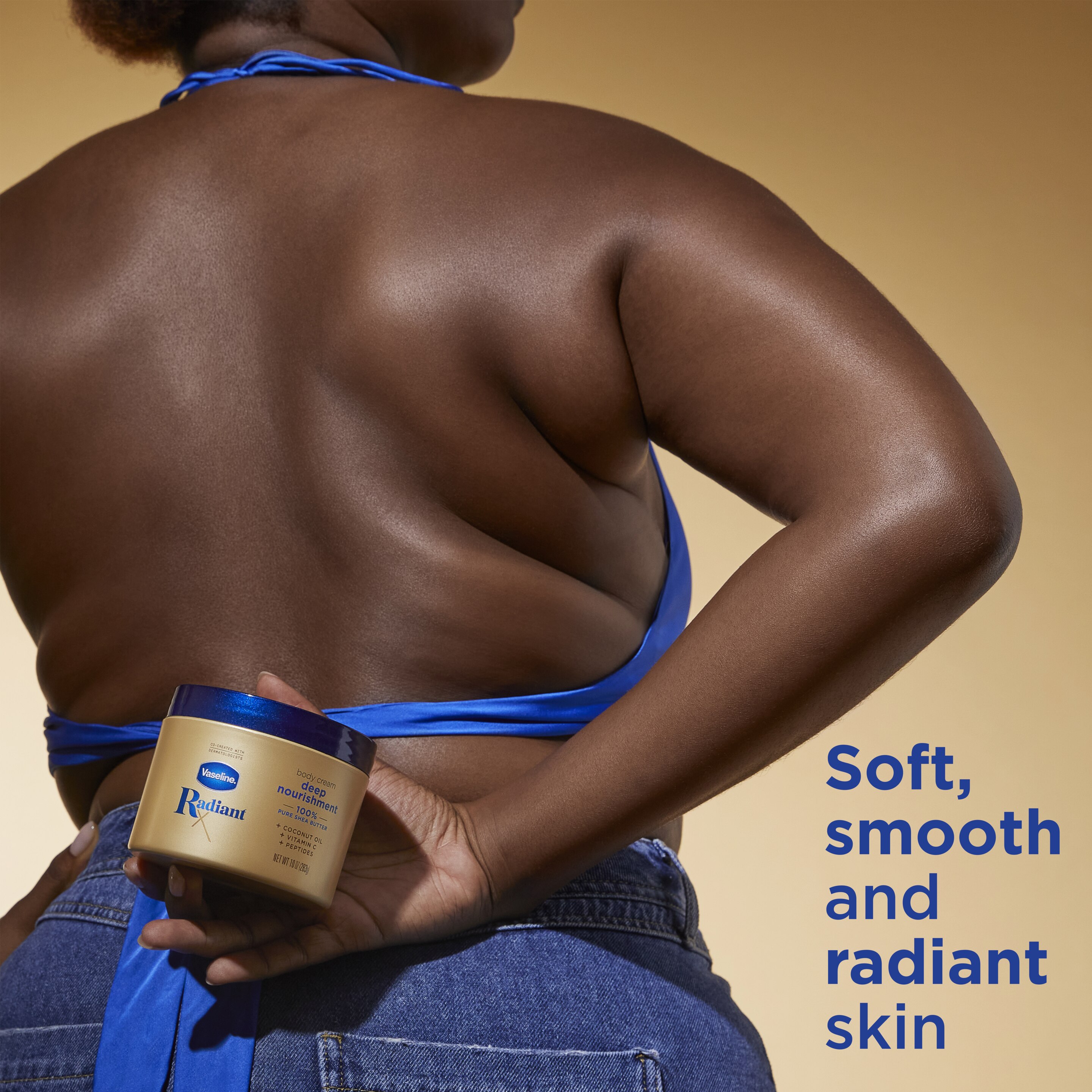 Woman holding Vaseline® Radiant X Deep Nourishment Body Cream