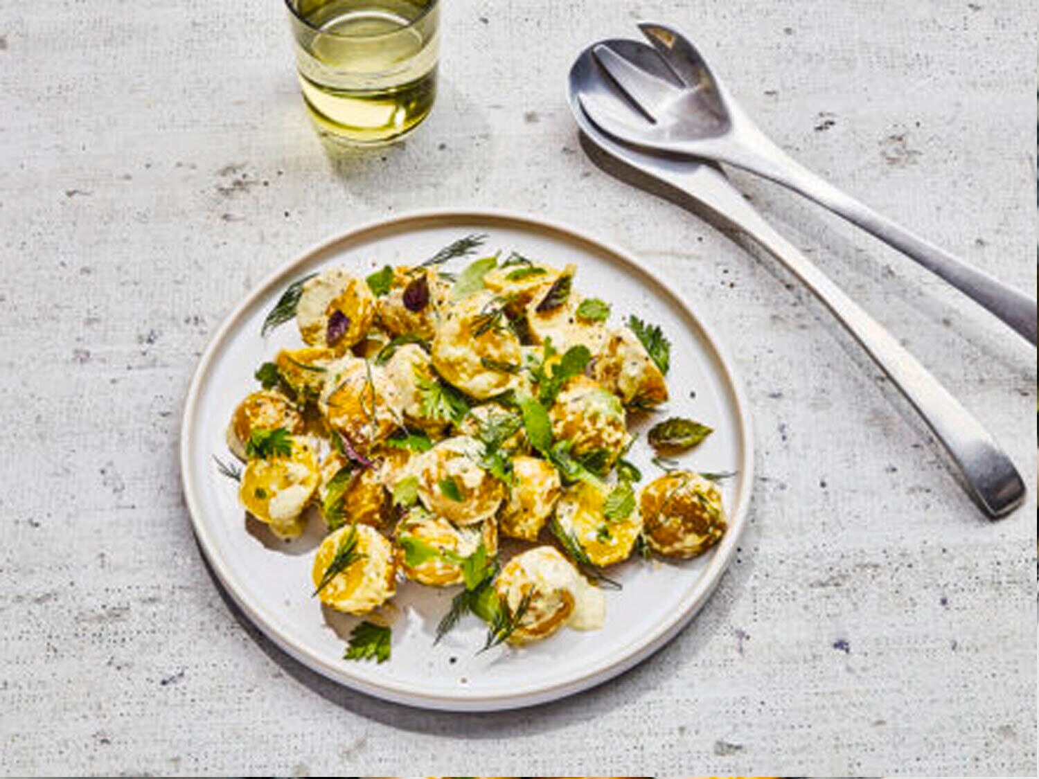 New potato salad with soft green herbs