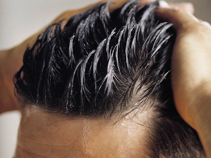 Man conditioning hair