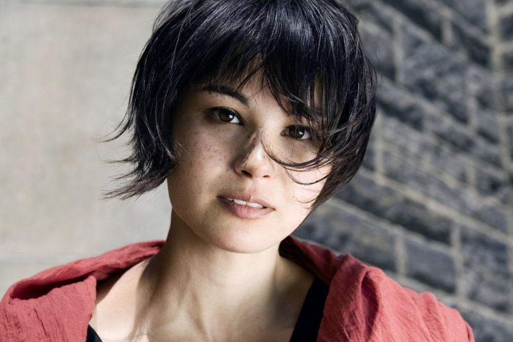 Asian woman with short, cropped hair