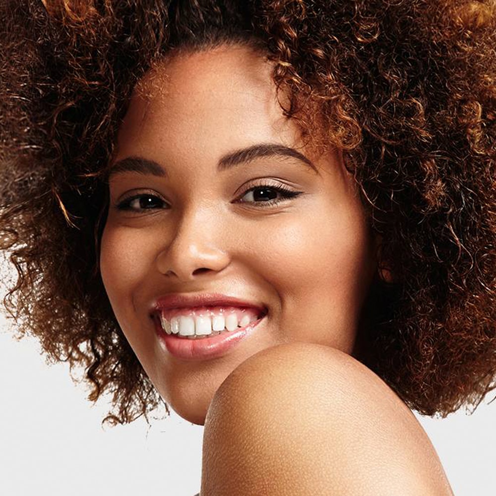 A beautiful woman showcasing her skin after dealing with dark spots on her face