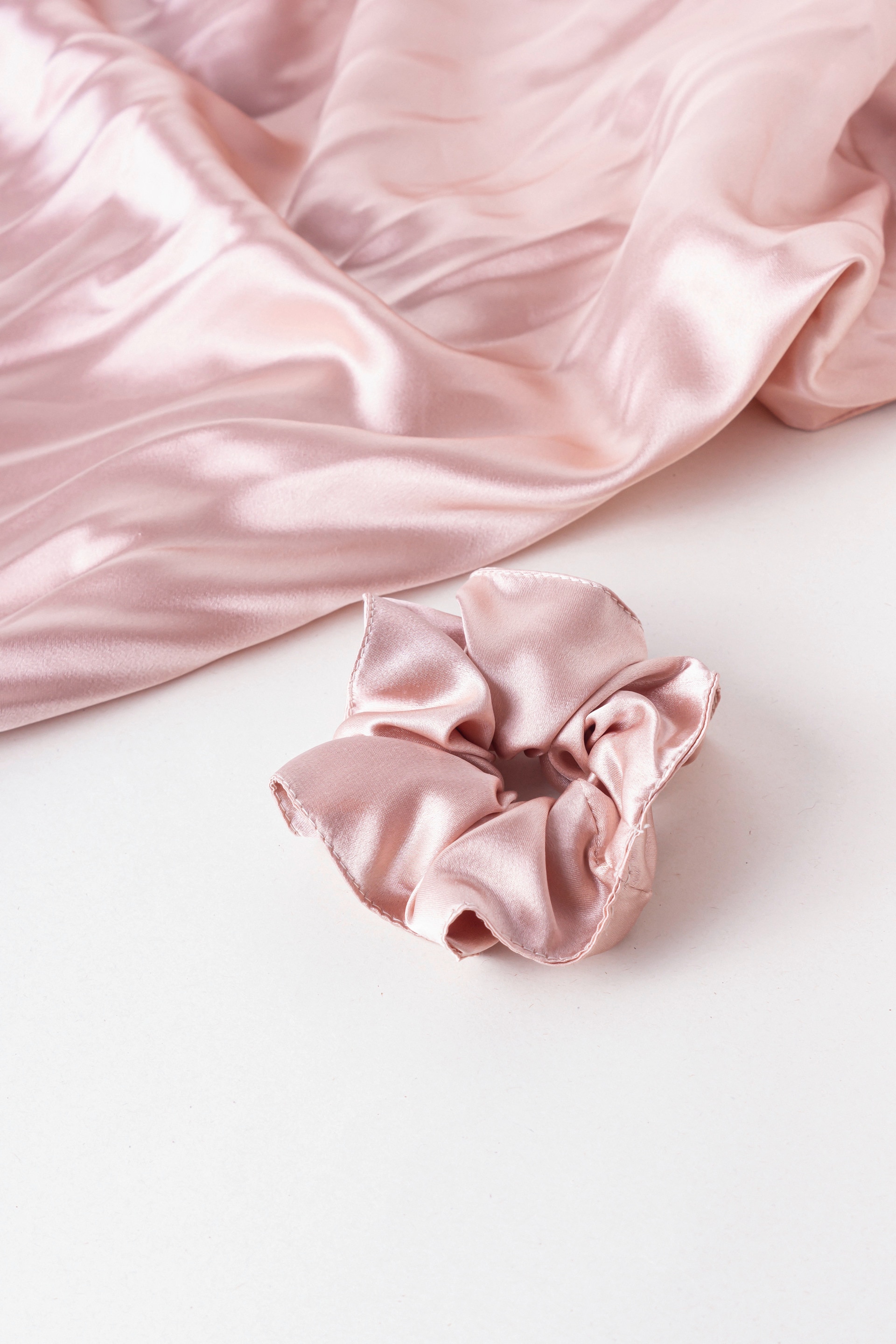 Pink silk fabric and scrunchie