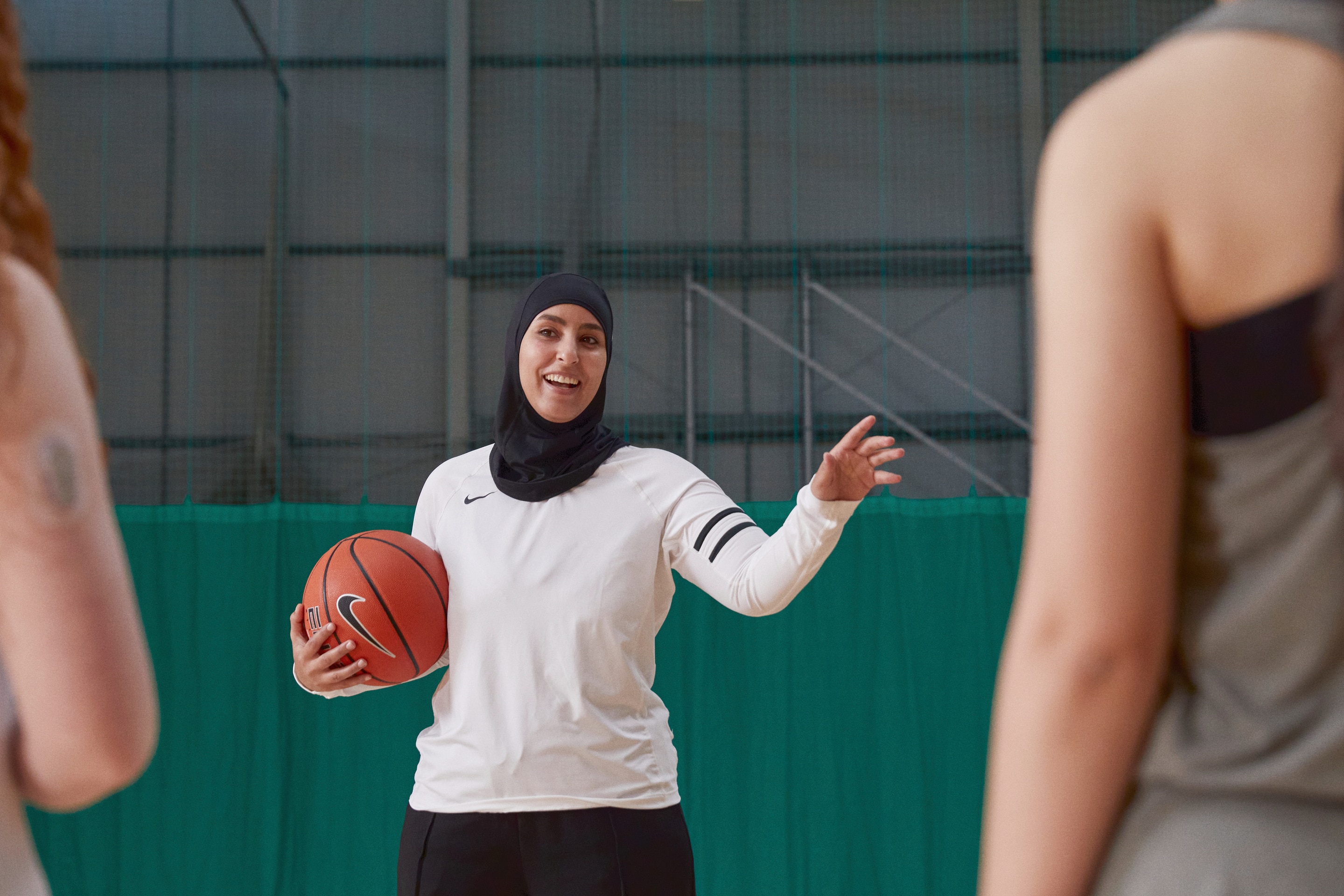 Sports Coach with her students 