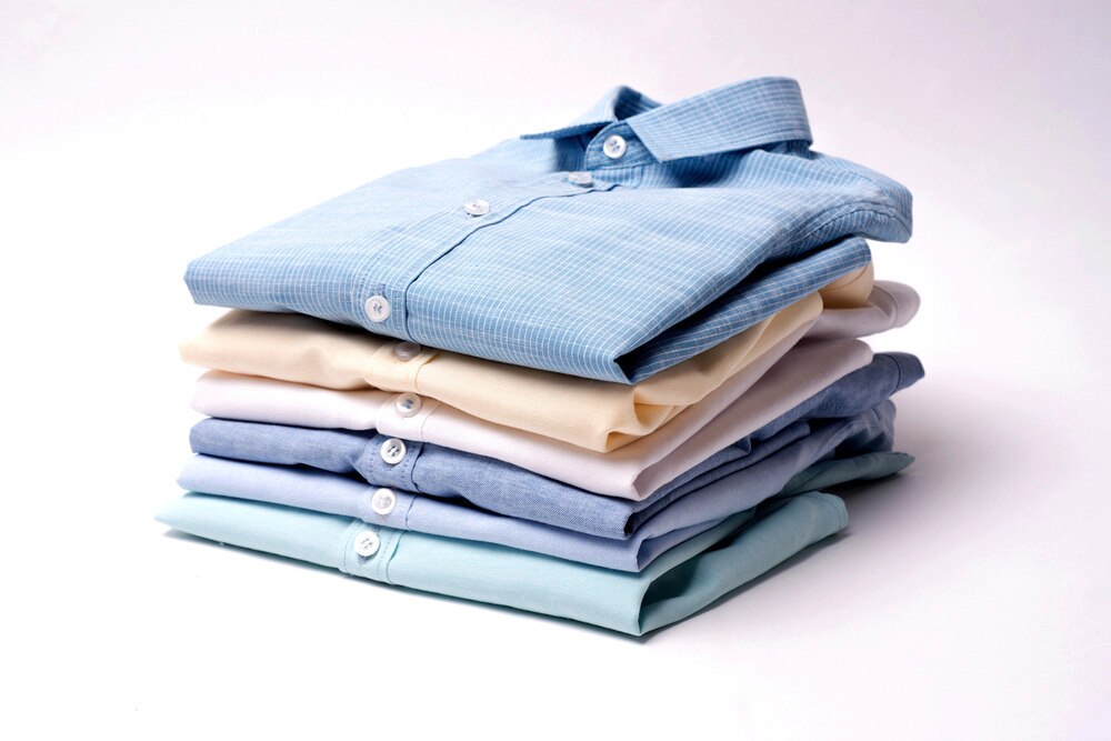 Classic men’s shirts folded and stacked