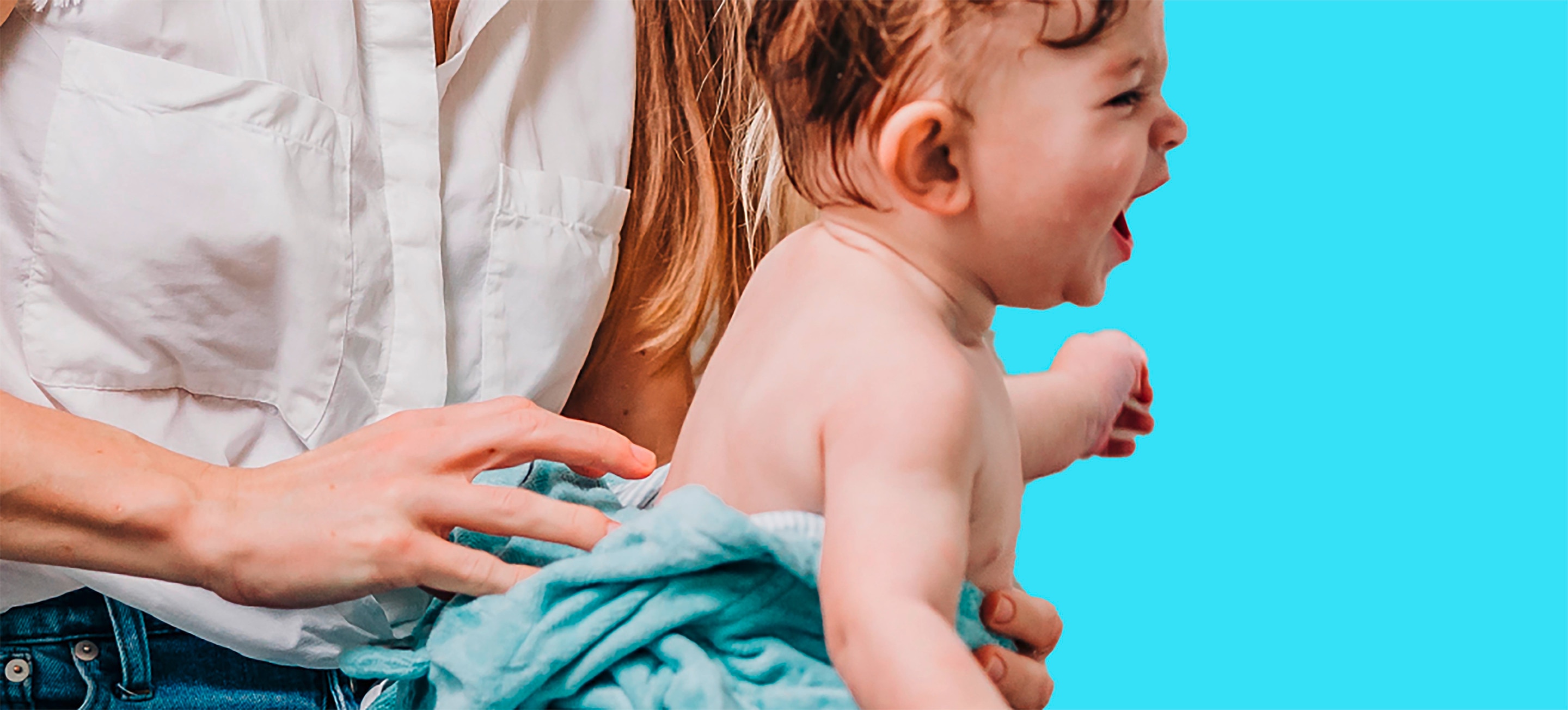 Close up of a baby being held