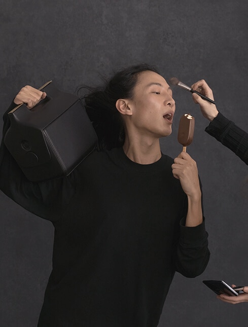 Alexander Wang carrying box whilst trying to eat a magnum