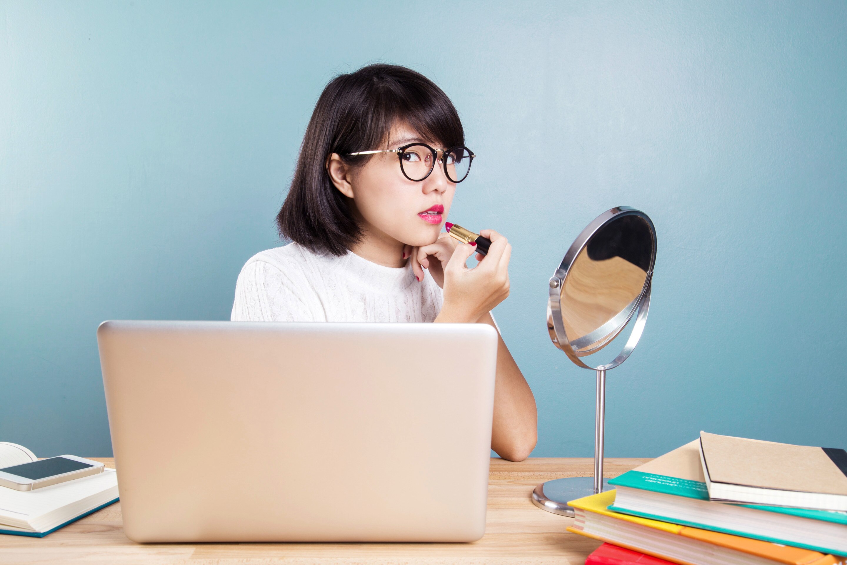 Young Asian woman at her workspace