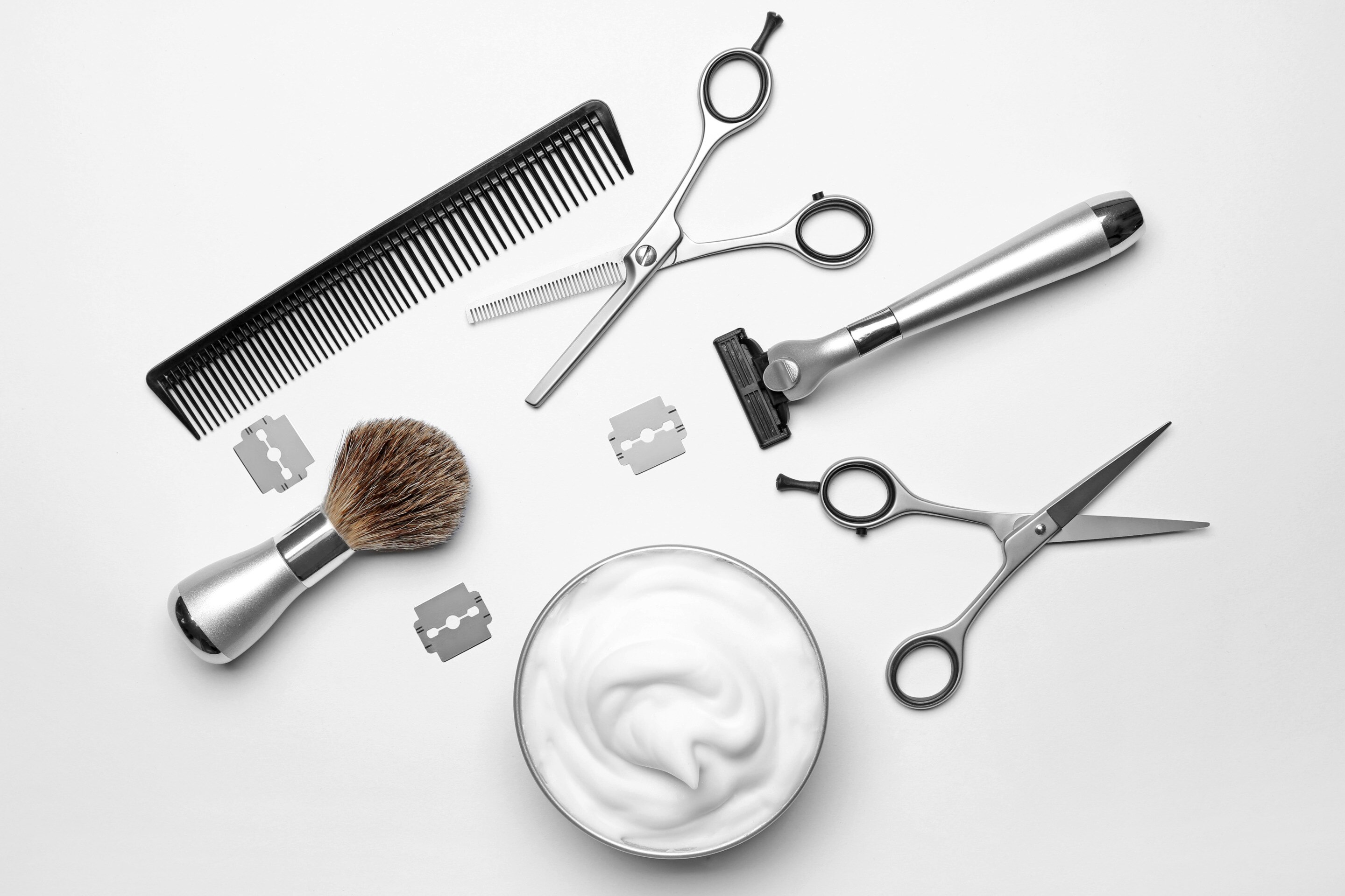 Beard grooming tools on white background