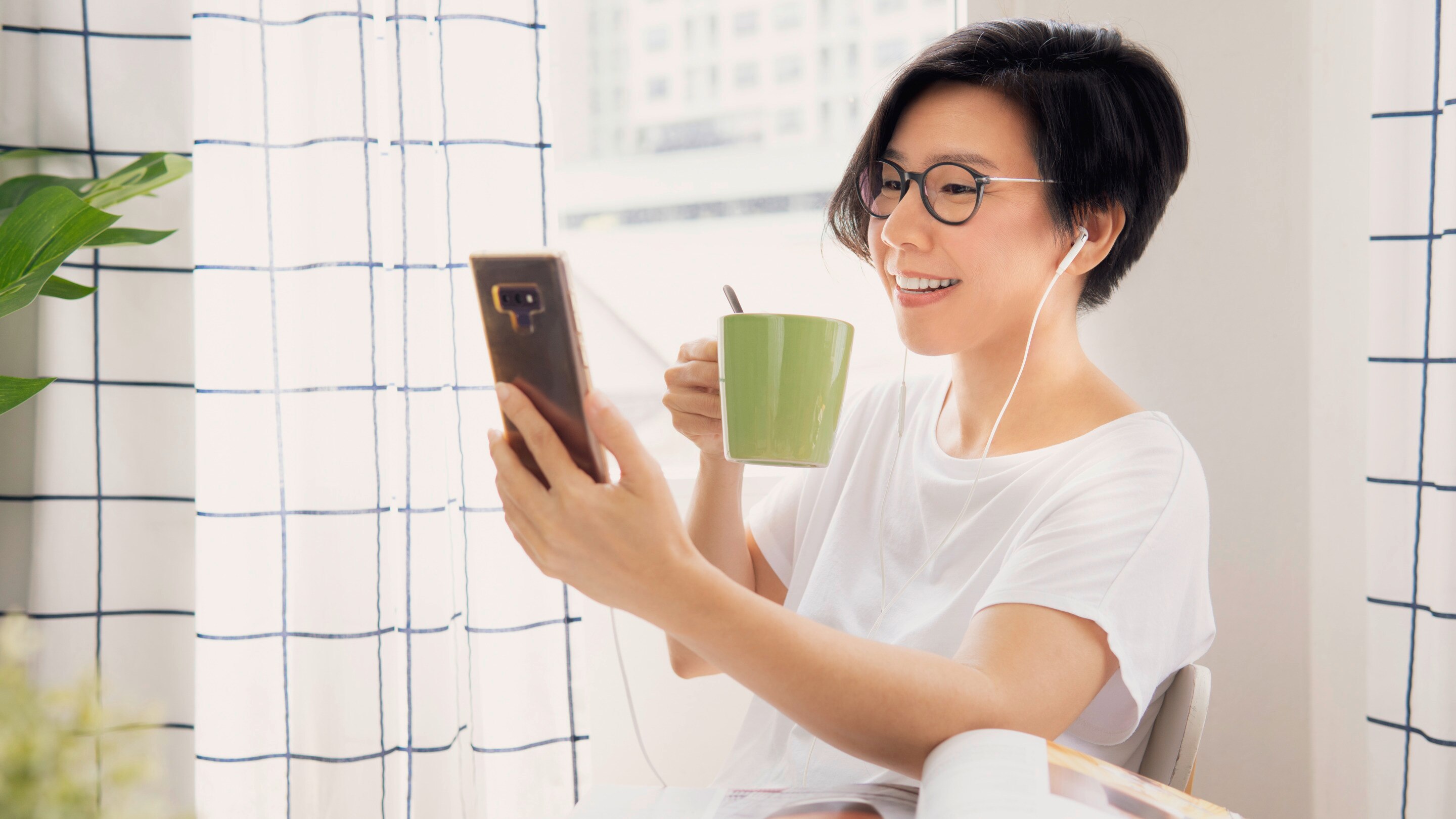 Asian woman on a video call on her phone 