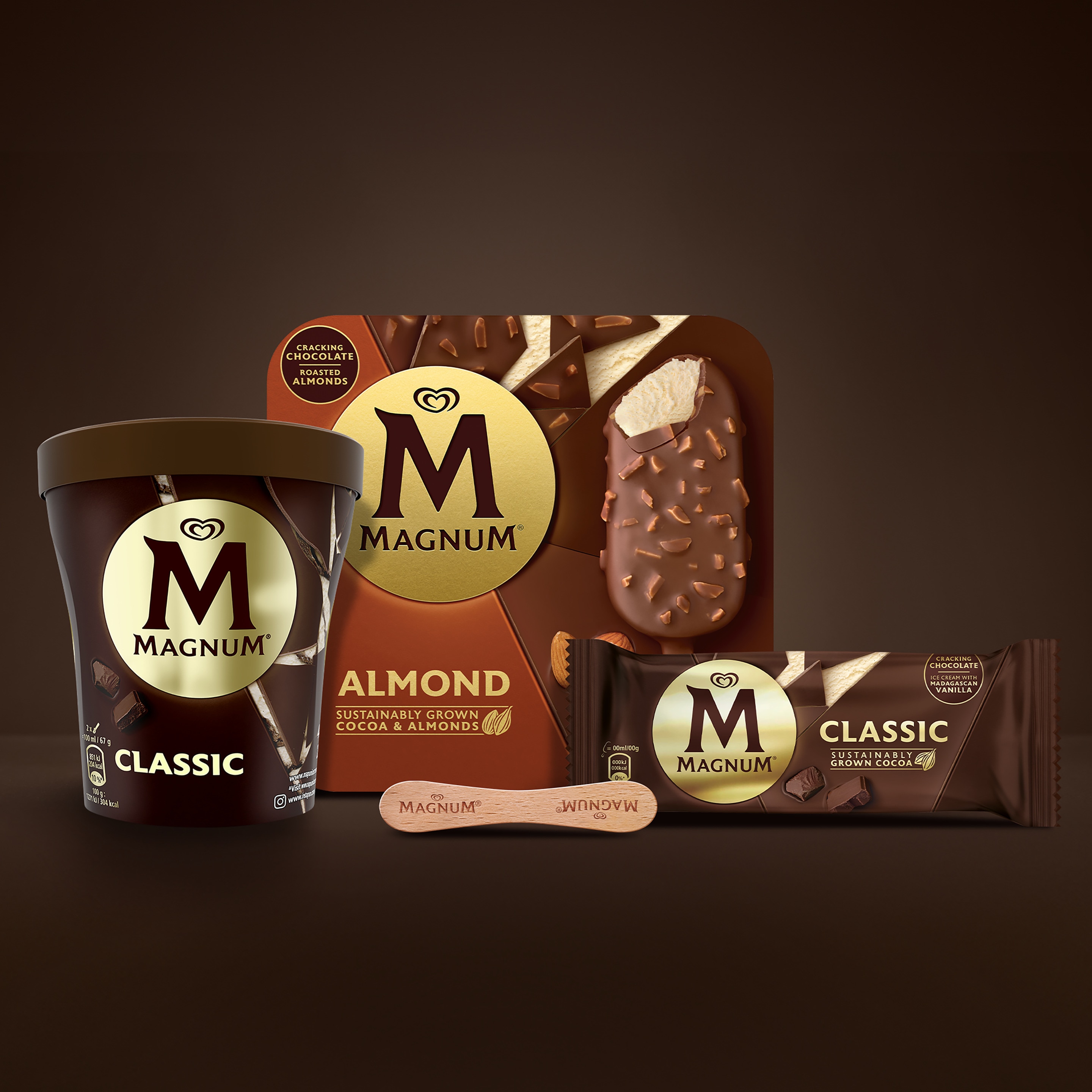 Composition of Magnum Classic Tub, Magnum Almond Multipack, Magnum Classic single pack, and Magnum wooden stick on brown background