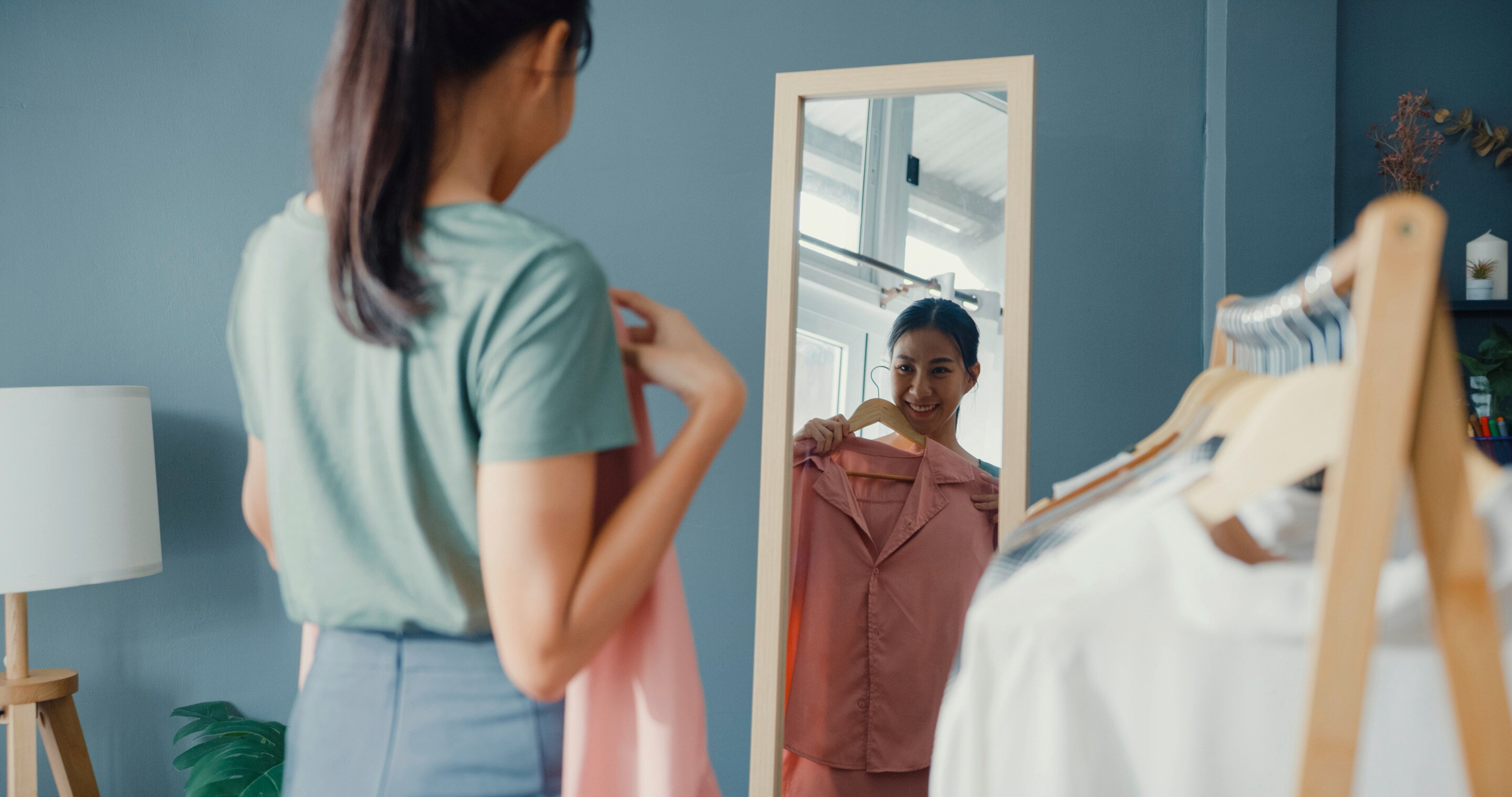 Asian woman choosing clothes 