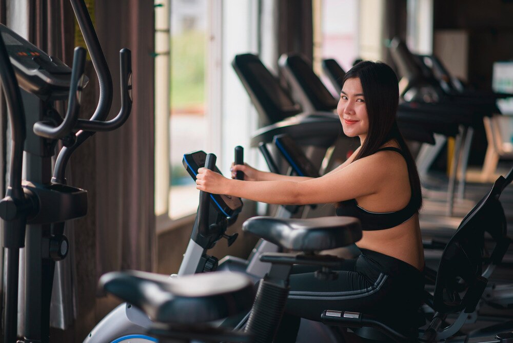 Asian woman in workout wear at the gym.