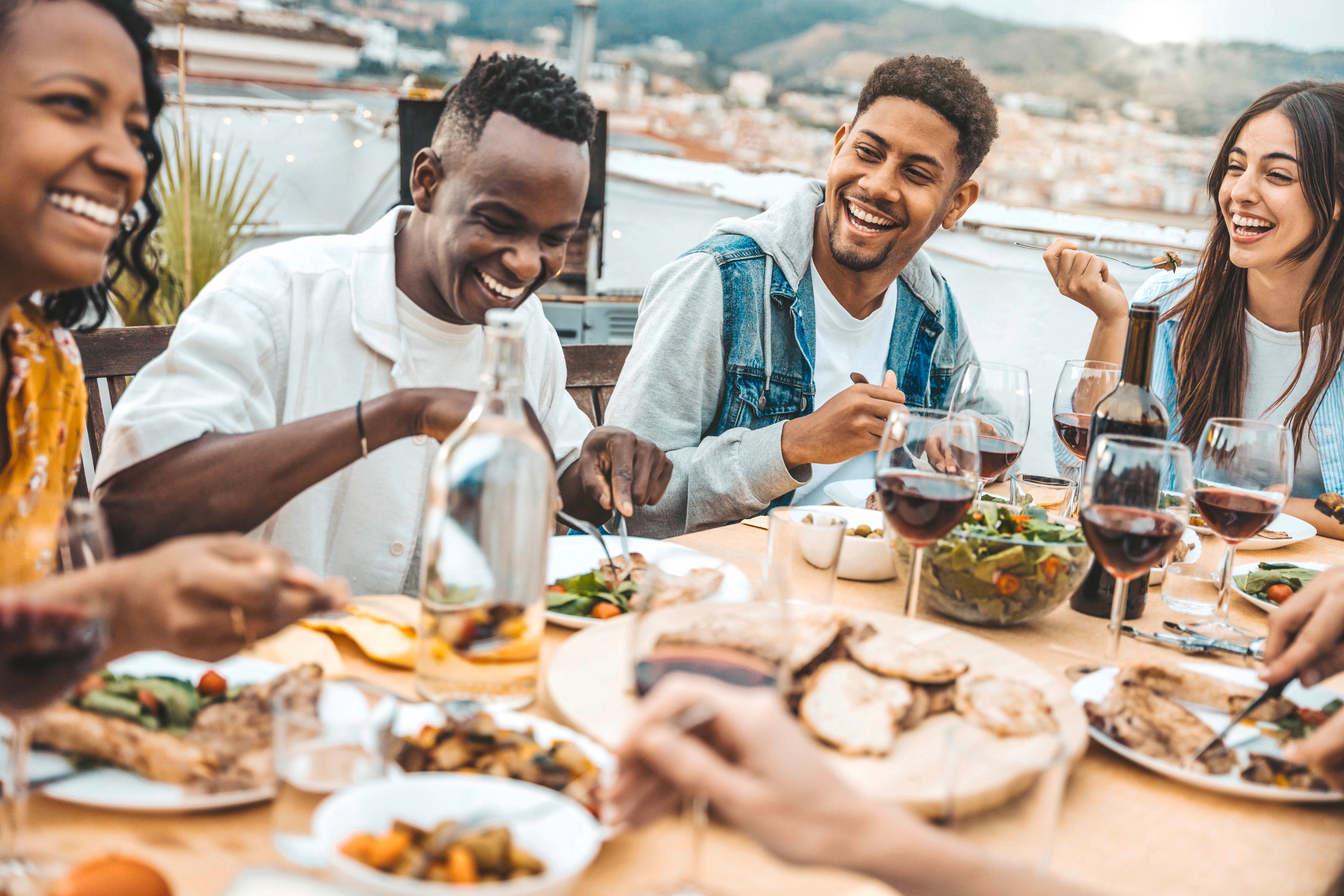 Group of friends eating dinner together.