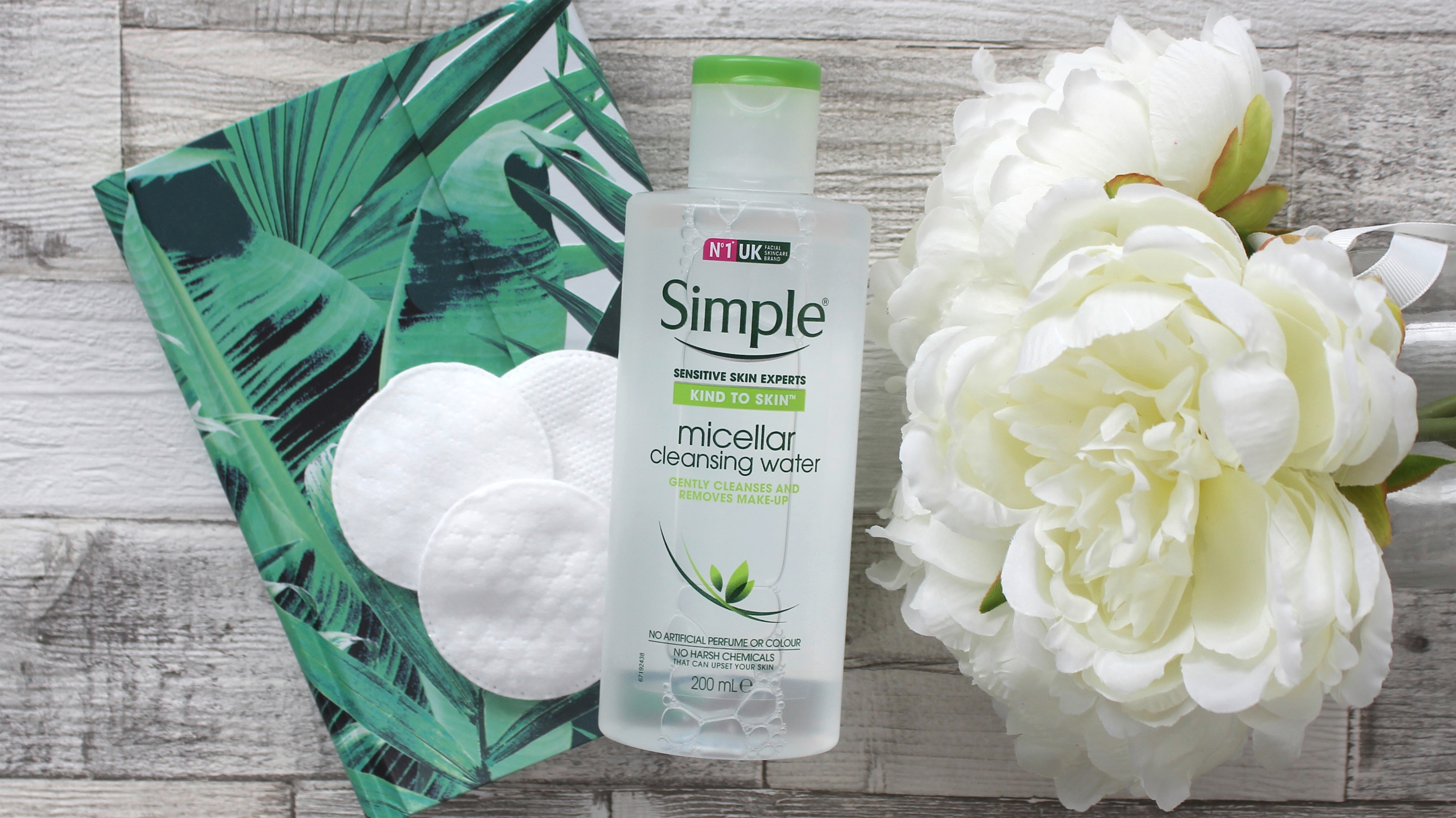 Simple Kind to Skin Micellar Cleansing Water alongside flowers