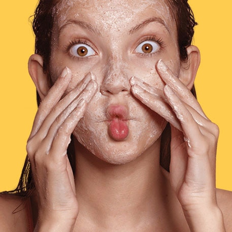 yellow background model scrubbing face