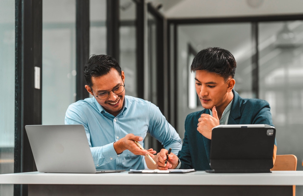 Two men discussing something at work.