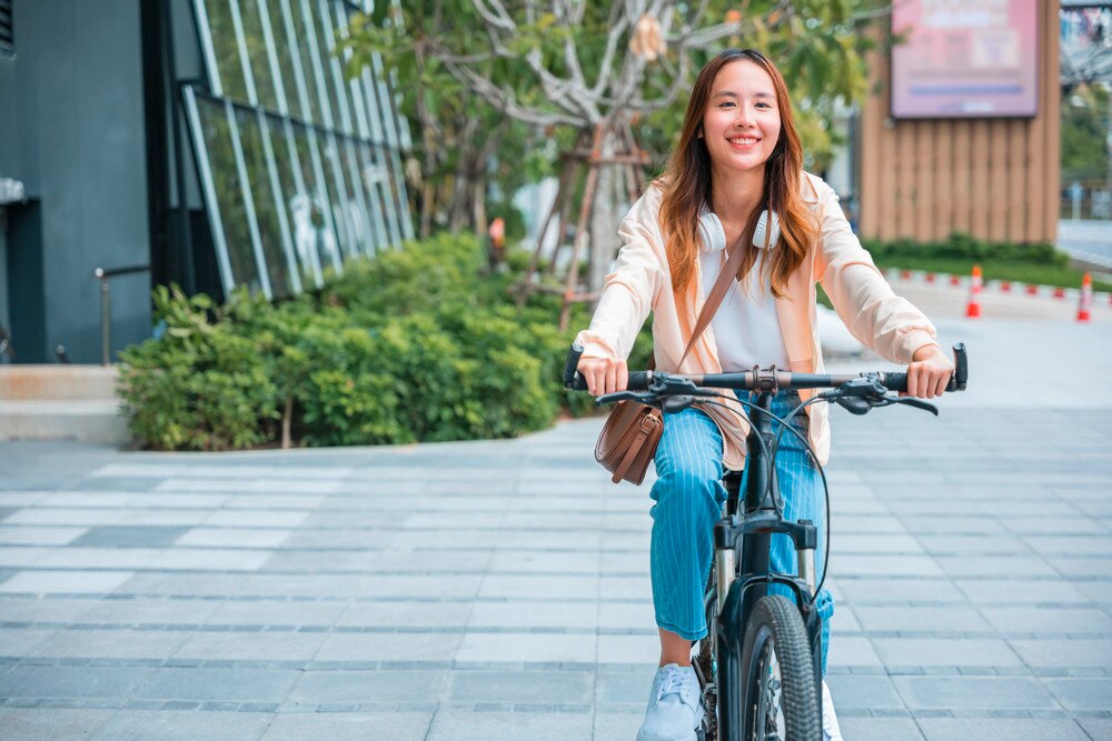 Young woman riding a bike to work.