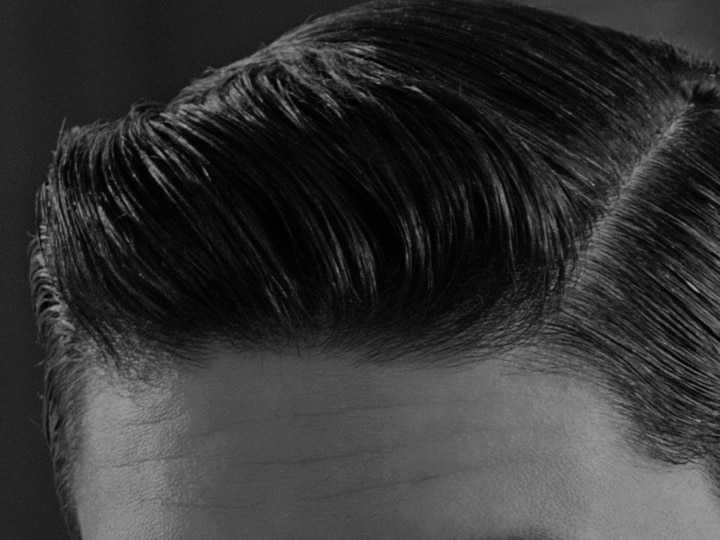 A guy with a side parting.