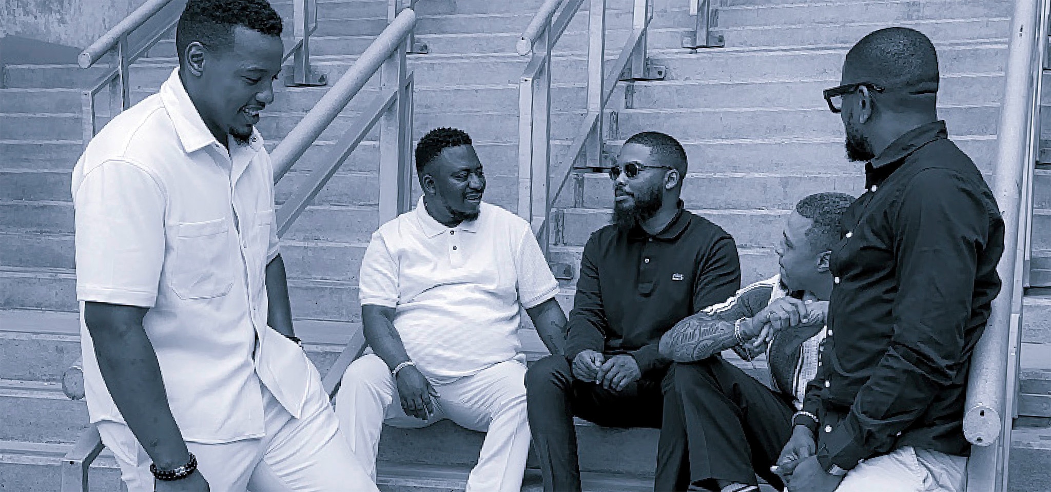 A group of handsome men discussing emotions for men