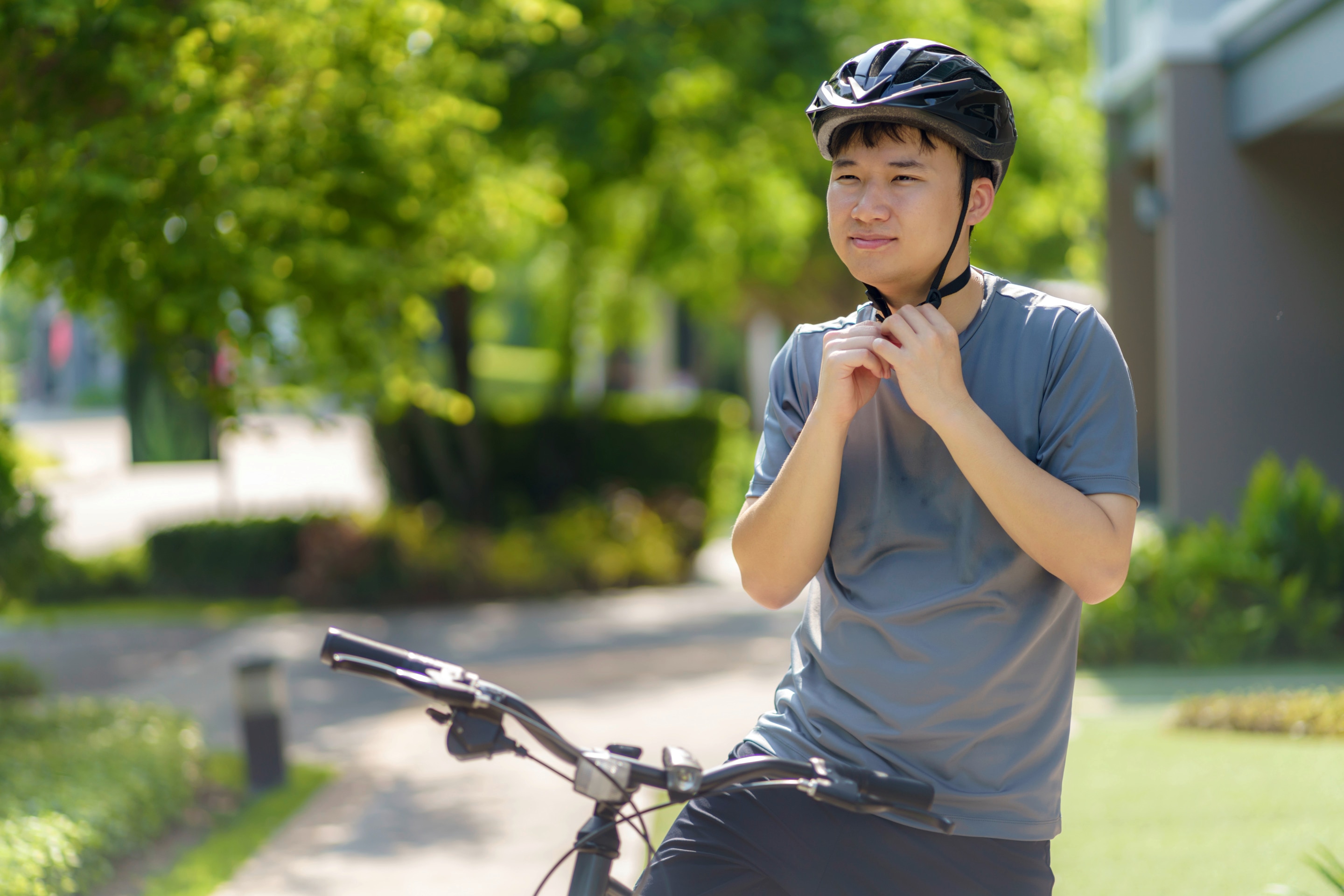 Asian man cycling outdoors 