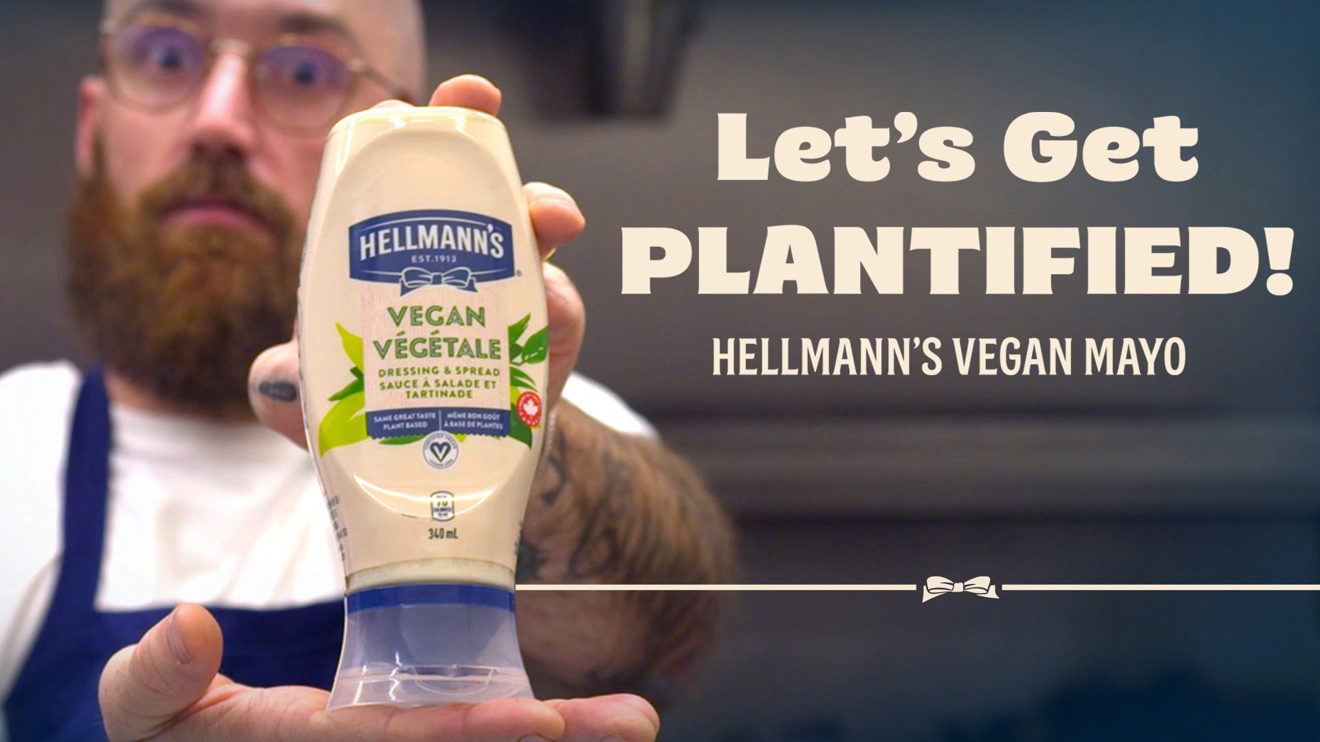 An image of a chef presenting the Hellmann's Vegan 340mL product in their hands alongside the text: “Let's Get PLANTIFIED! Hellmann's Vegan Mayo