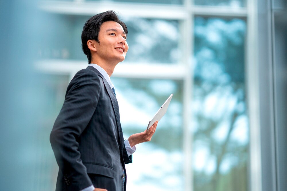 A portrait of a smiling businessman in a suit
