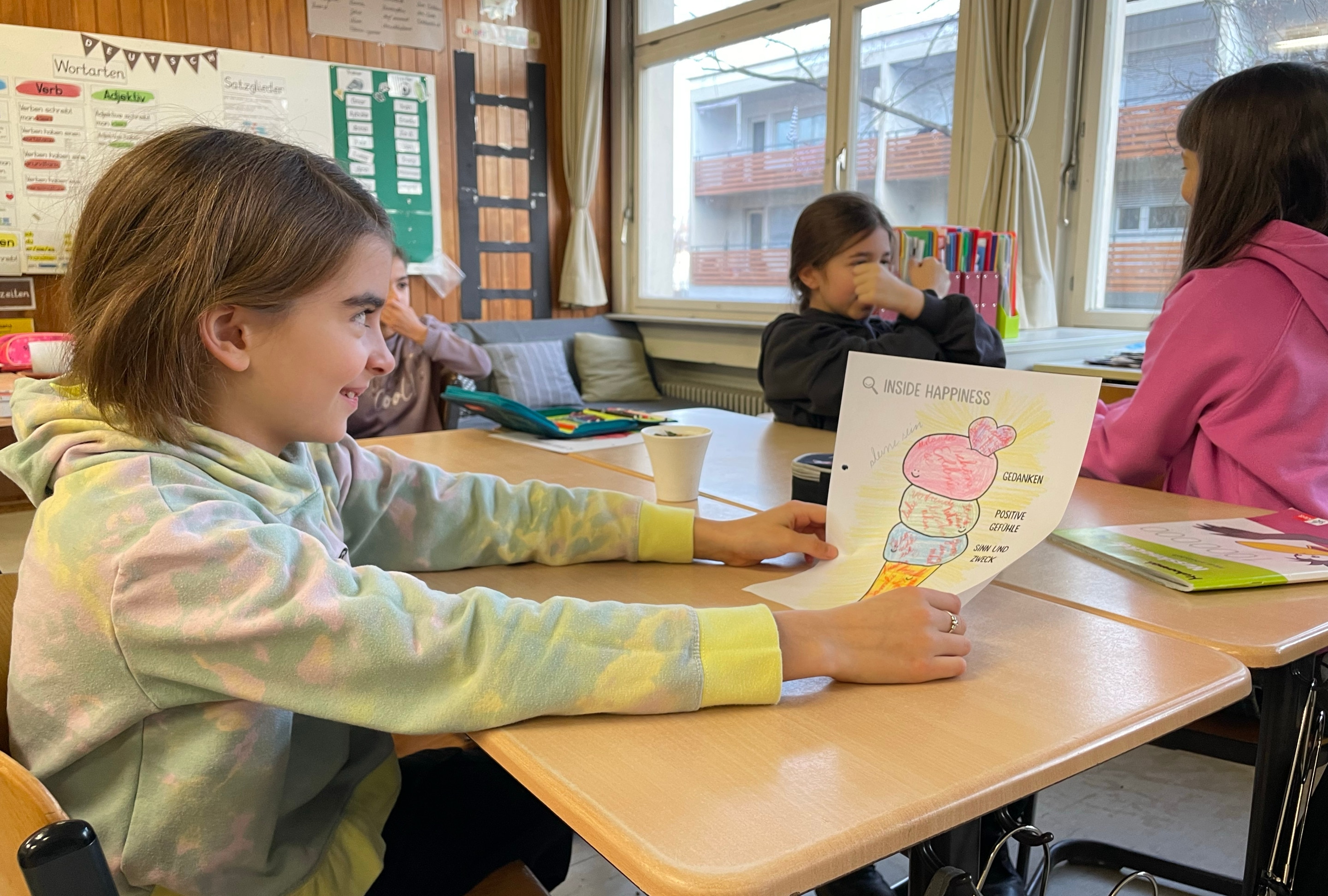 A young girl showing off her happiness ice cream