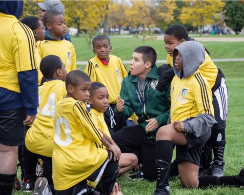 A team of soccer players and coaches