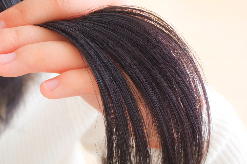 Closeup of a woman’s black hair.