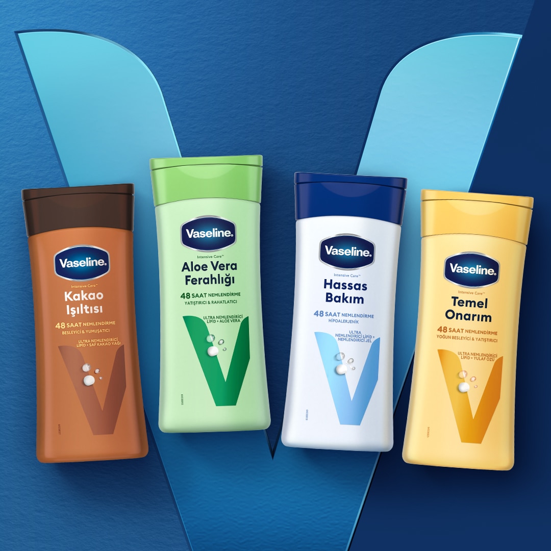 Hand holding Vaseline bottle in the air