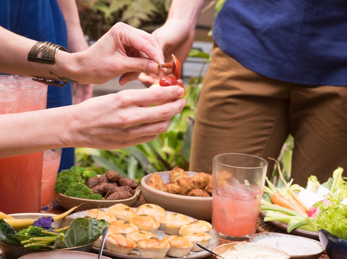 A group of friends sharing nibbles